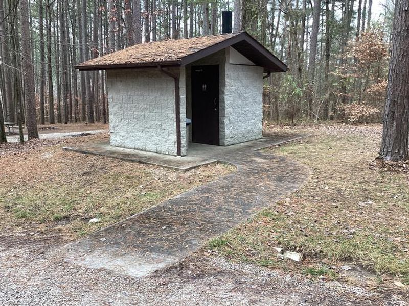 A photo of the vault toilet at Saddle Lake Campground