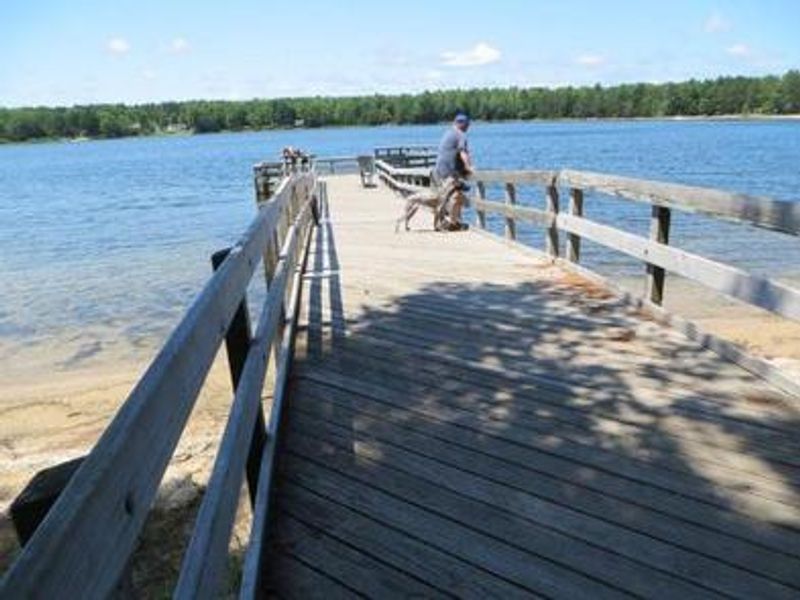 View of the fishing pier at Camp Seven Lake Campground