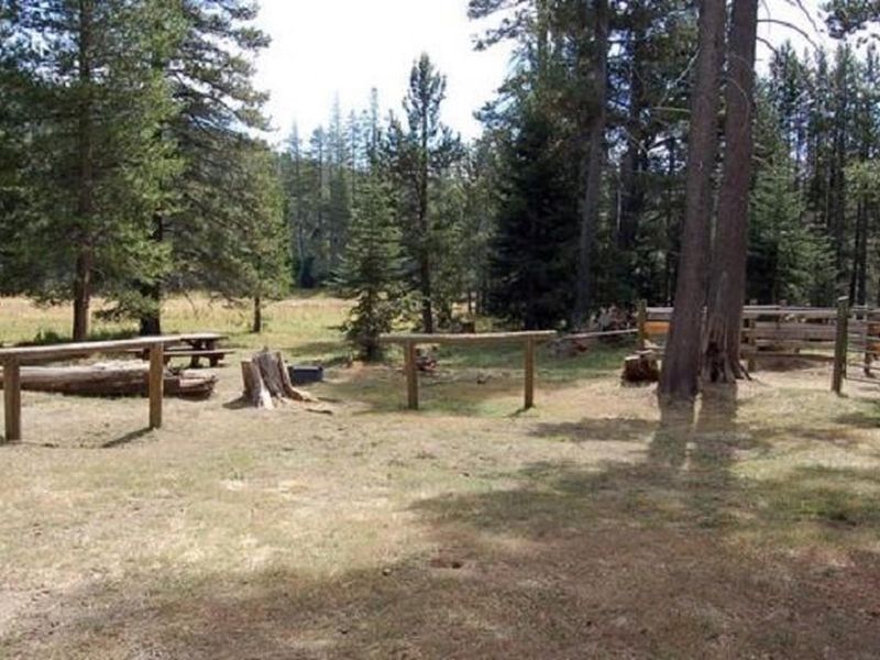 Hitching rails and one of the large corrals at Little Lasier Horse Camp
