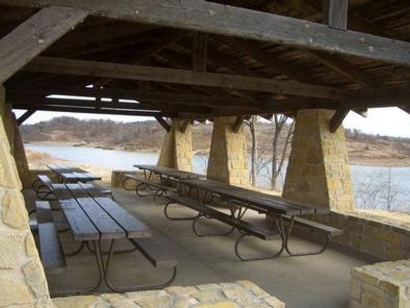 A view of the interior of the pavilion showing 4 picnic tables