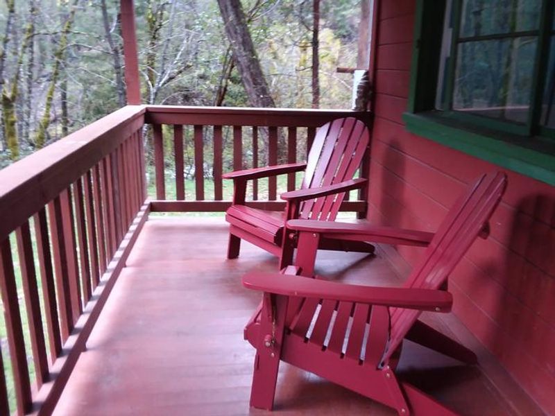 Enjoy sitting out under covering on the front porch of the historic Forest Glen Guard Station.
