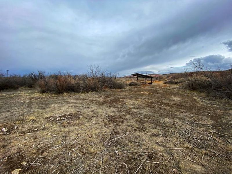 Westwater Group Site picnic tables underneath shade shelter.