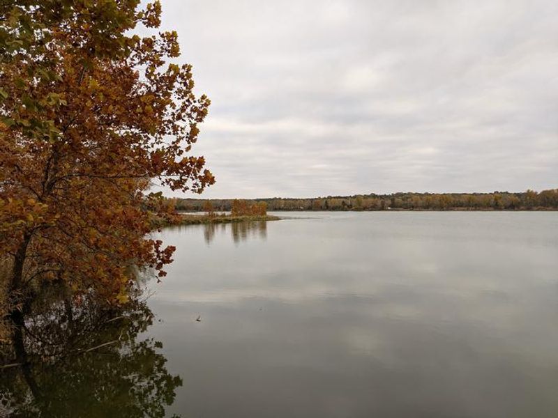 Fall colors overlook the gathering pond at Outlet Park