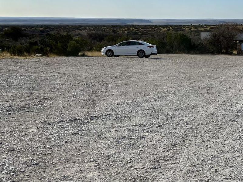 Trailhead parking located next to the Frijole Horse Corral Campsite.  In the background you can see traffic passing along U.S. Hwy 62/180.  Highway noise should be considered prior to reserving this campsite.