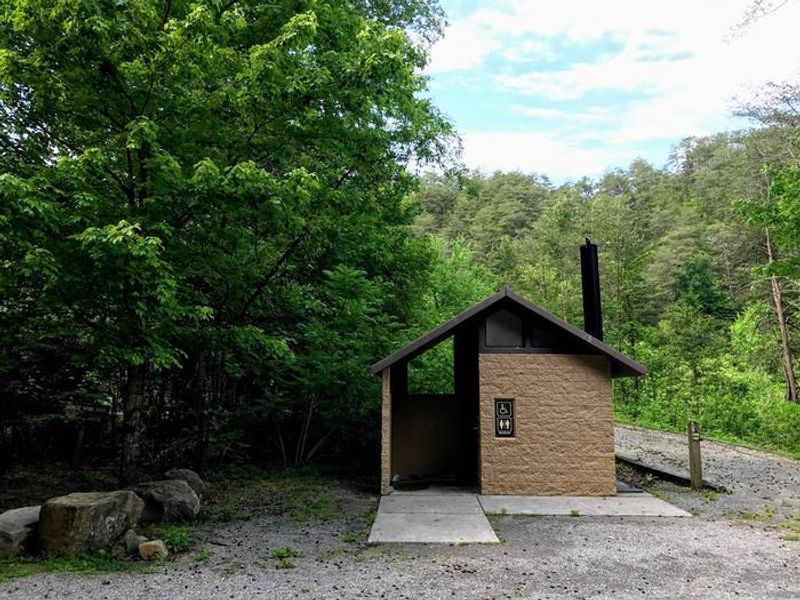 Vault toilet near entrance of campground