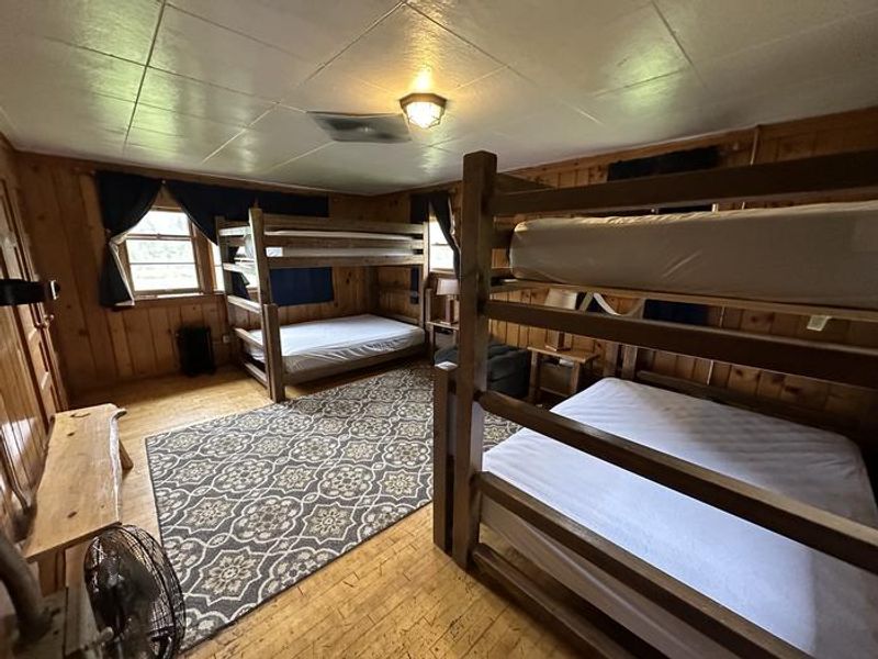Star Meadow Guard Station bedroom interior with two bunk beds with queen and full mattresses, sleeps 6.