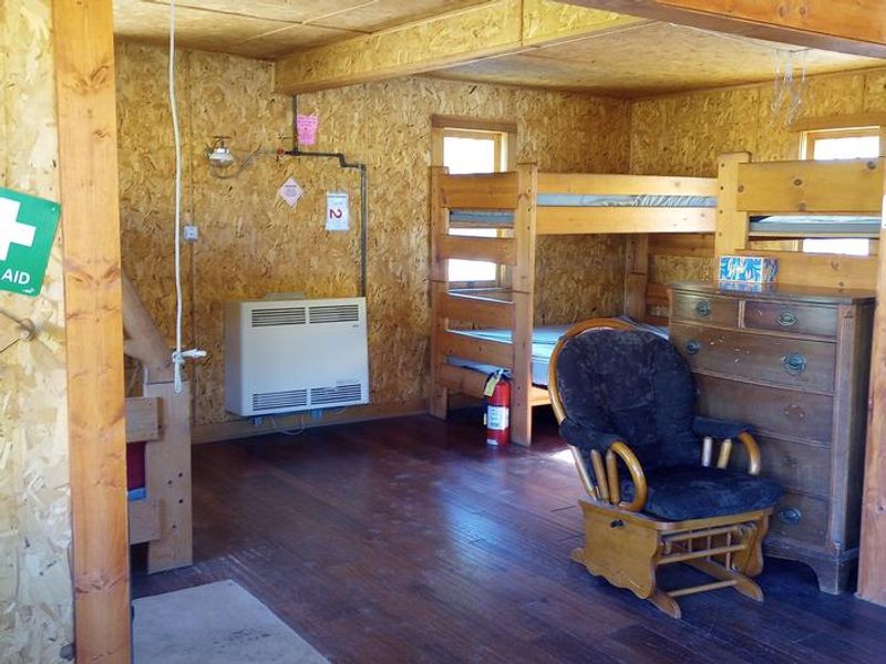 Open cabin includes 3 beds, sleeps up to 9.