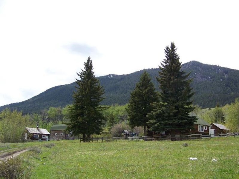 View of rental cabin, barn and range rider cabin