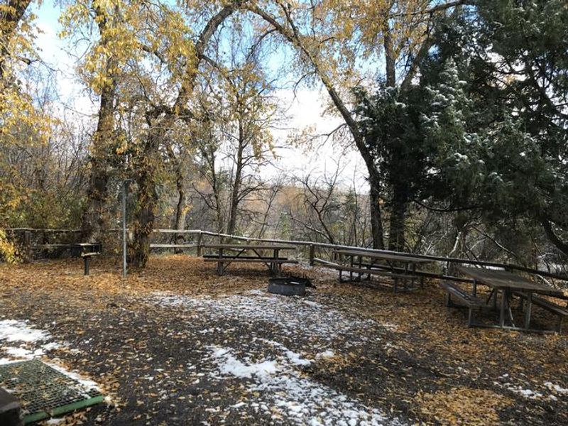 The back picnic area offers 3 picnic tables, a campire ring, a barbeque, and a lantern post. 
