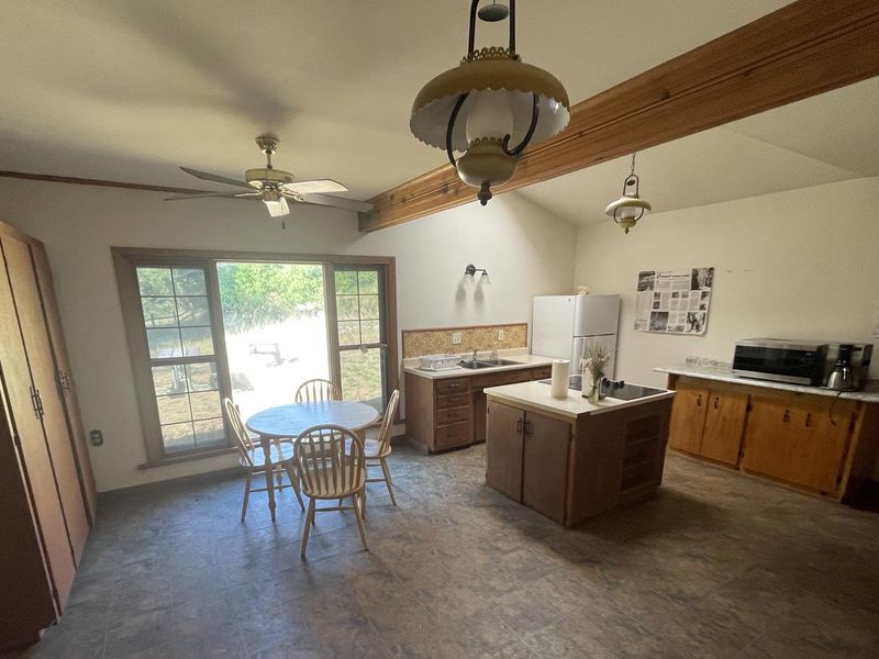 Kitchen of Half Moon Ranch outiftted with major appliances and cooking supplies.