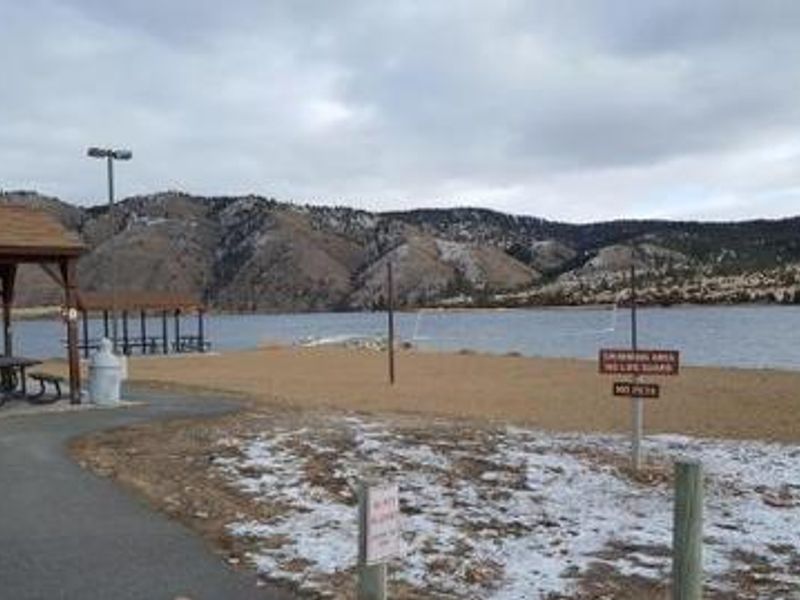 Beach volleyball court by swimming area