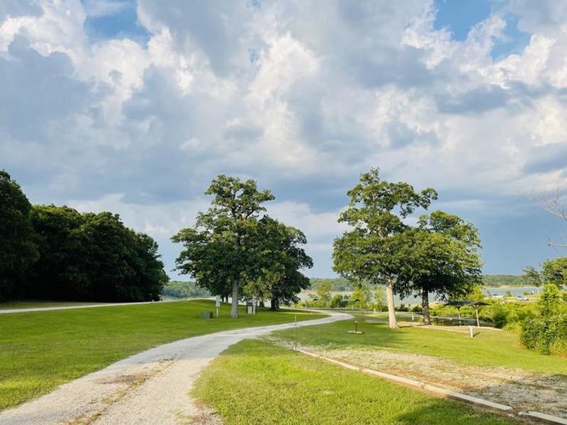 A photo of facility BUNCOMBE CREEK with Picnic Table, Electricity Hookup, Fire Pit, Shade, Water Hookup