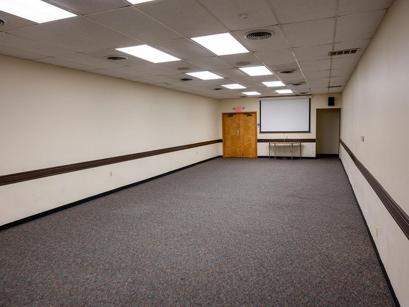 The conference room is located inside the gym building and can accommodate 50 people. Chairs and 6 ft. tables are available in the adjacent storage room.