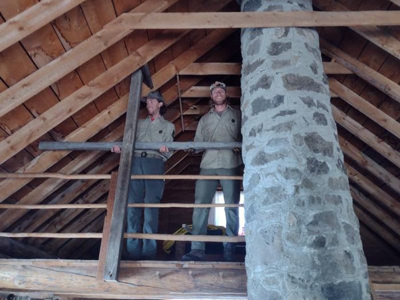 Crews installing railing in cabin loft