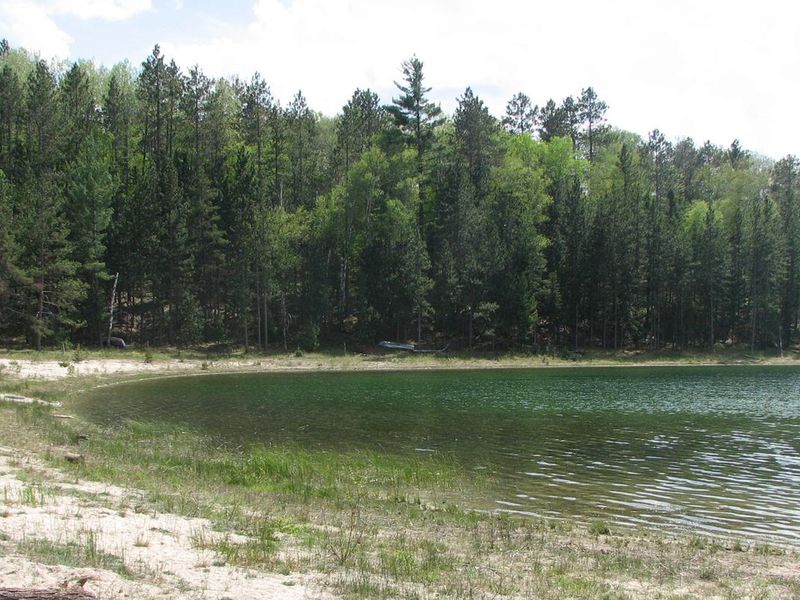 The view of the shoreline along Wagner Lake from the Wagner Lake Campground Beach.