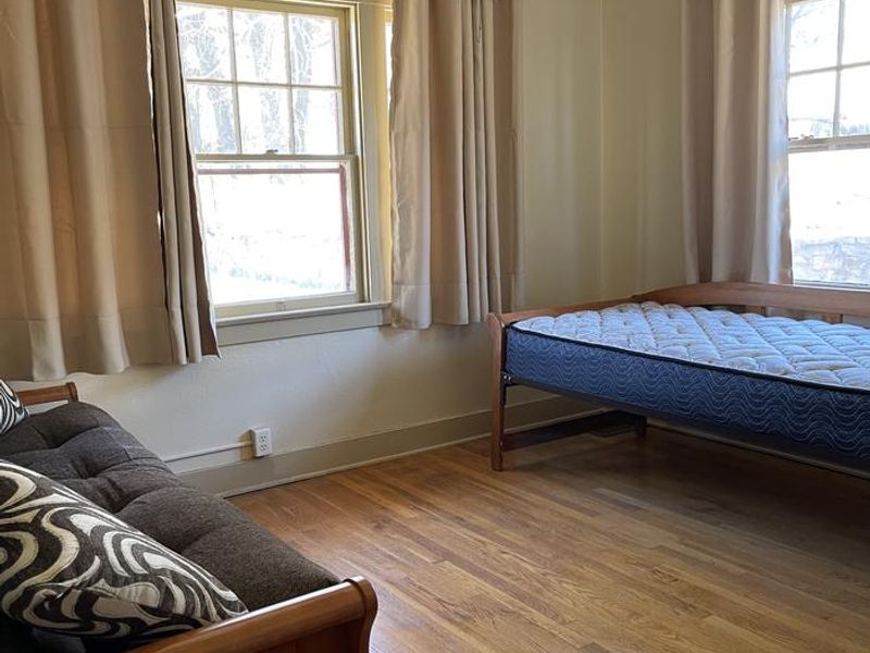 Bedroom with bed and futon