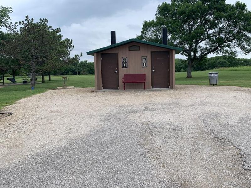 Vault restroom located near the entrance of Overlook Park and Shelter 2