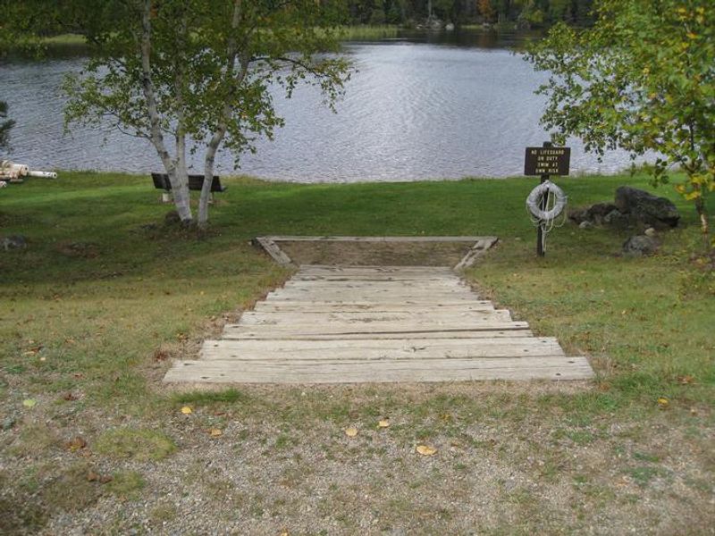Beach area.  Steps provide access to sand beach area and benches.