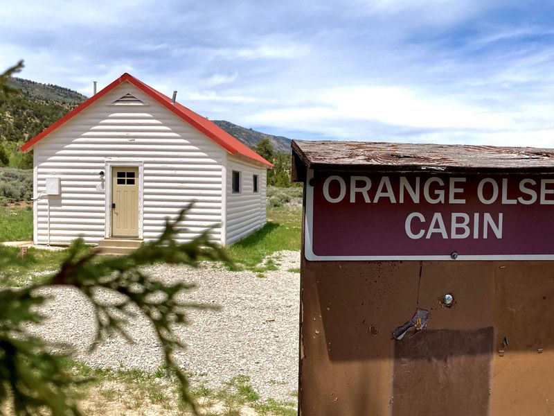 An Orange Olsen Cabin sign marks the structure in Joes Valley.