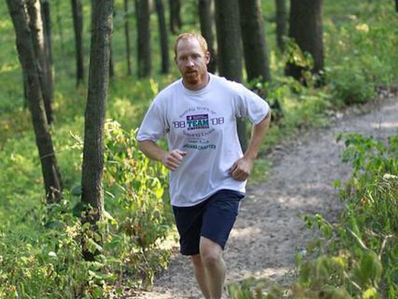 Jogger on the Cowles Bog trail in the Indiana Dunes National Park.