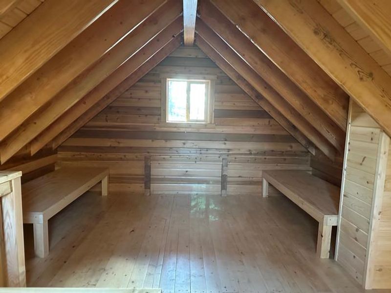 Sleeping area upstairs with two moveable sleeping platforms.  