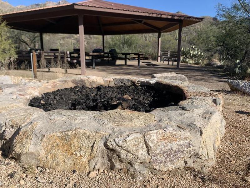 Stone fire pit adjacent to Ramada 1