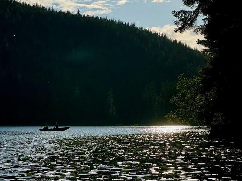 Fishing from skiff at sunset