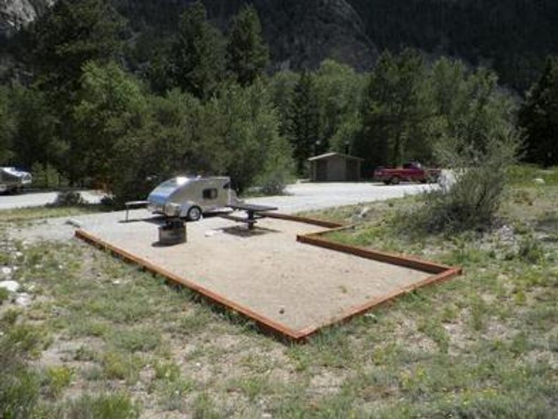 Campsite with small camper trailer