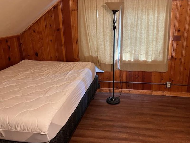 A view of the smaller of the two upstairs bedrooms