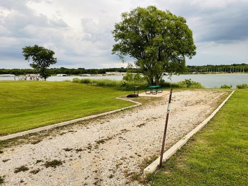 A photo of facility CANEY CREEK with Picnic Table, Electricity Hookup, Fire Pit, Waterfront, Water Hookup