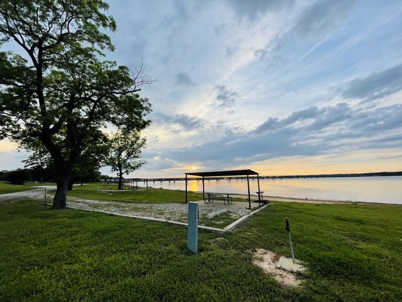 A photo of facility JUNIPER POINT with Picnic Table, Electricity Hookup, Shade, Waterfront, Water Hookup