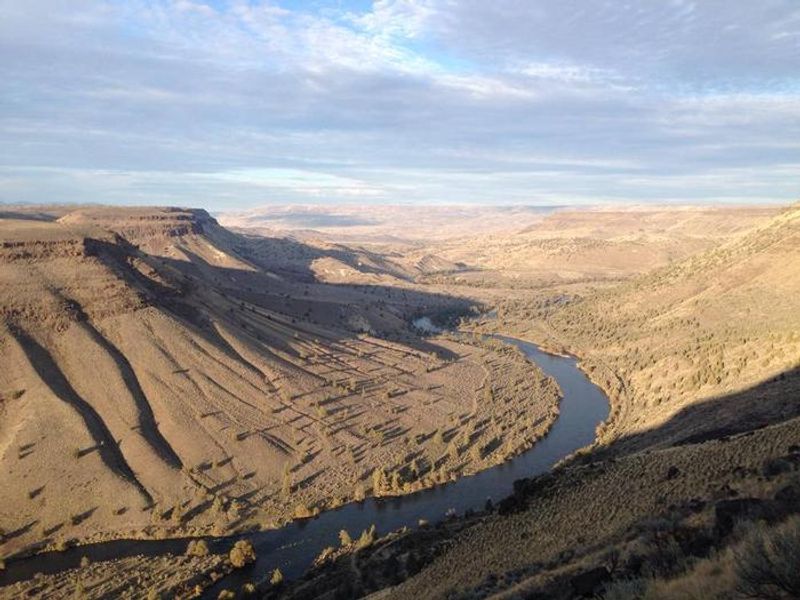 View of the the Deschutes river and canyon from Trout Creek Climbing Area, Oregon. Trout Creek Campground located on the distant bend in the river.