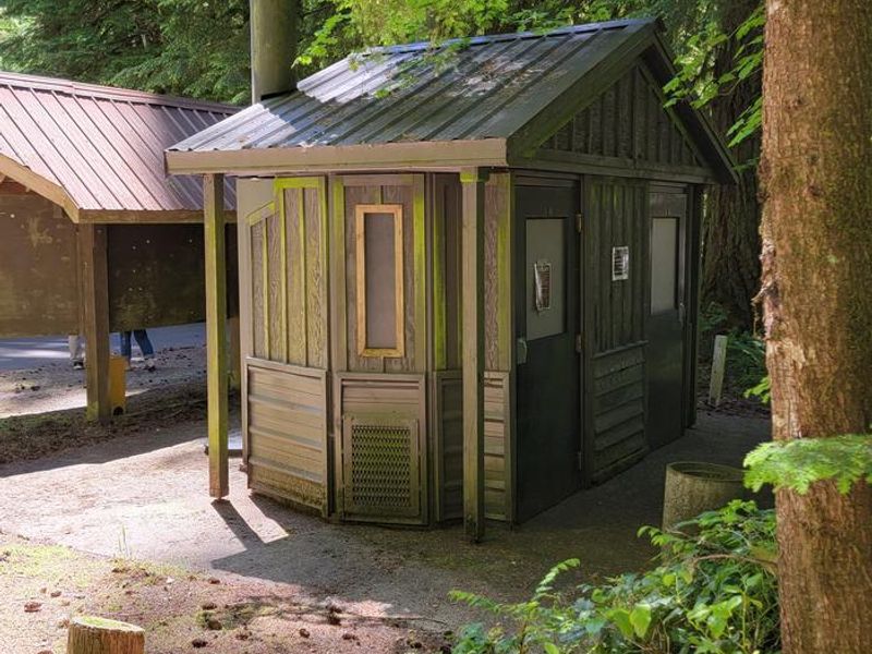 Yellowbottom Campground vault toilet #1 located behind fee station