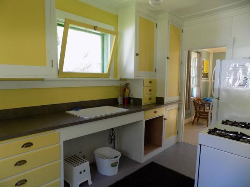 Kitchen with gas stove and refrigerator
