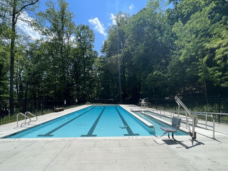 The fenced, outdoor swimming pool at Camp Misty Mount is a big hit during the hot summer days.  