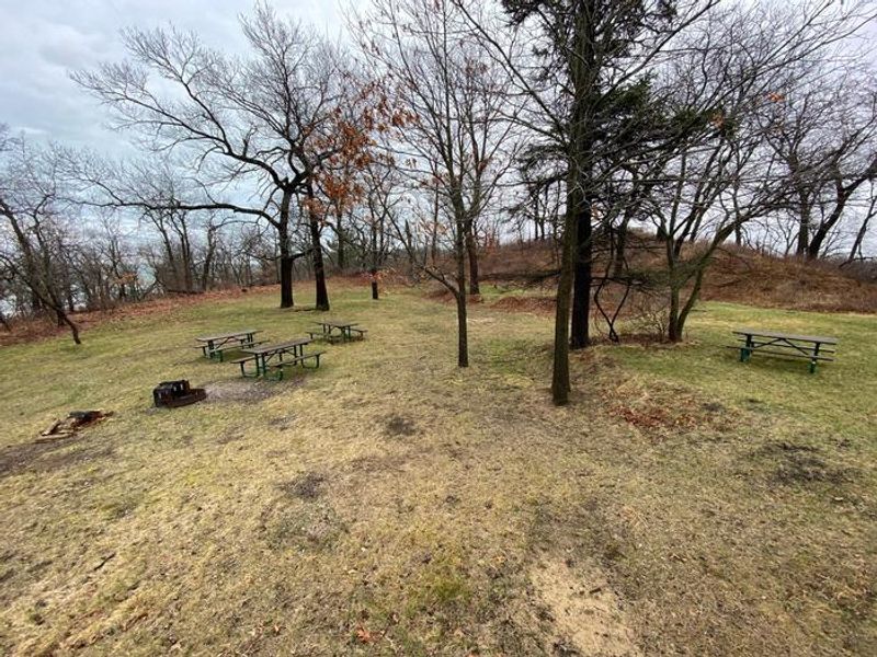 Picnic tables and a fire pit are available for use at the Dunbar group camp site.