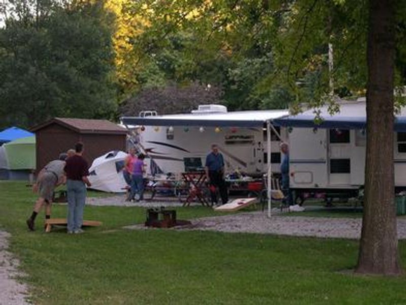 People playing game at their campsite.