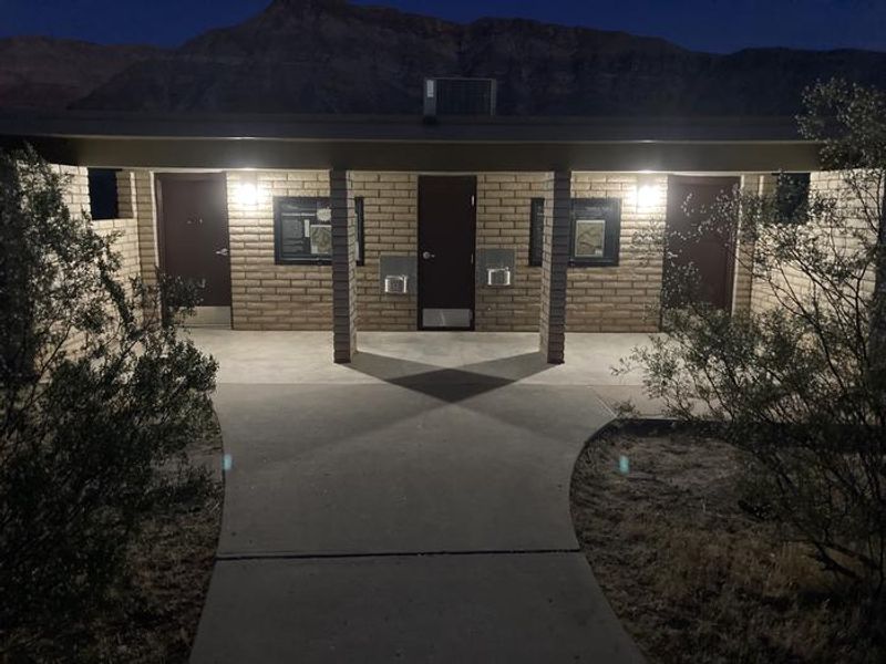 Well-lit restrooms at night.