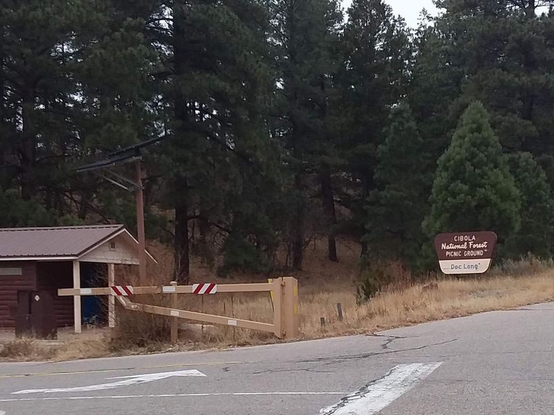 Site entrance and sign to Doc long