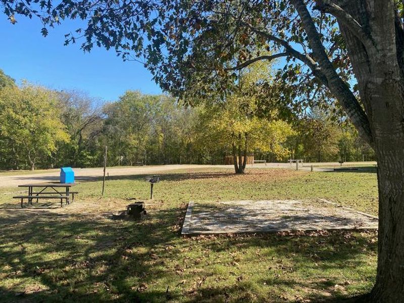 A tent pad under a tree at Tyler Bend Campground