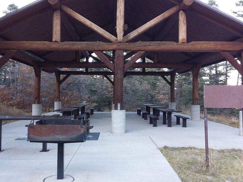 Capulin Spring Pavilion with multiple picnic tables and grills