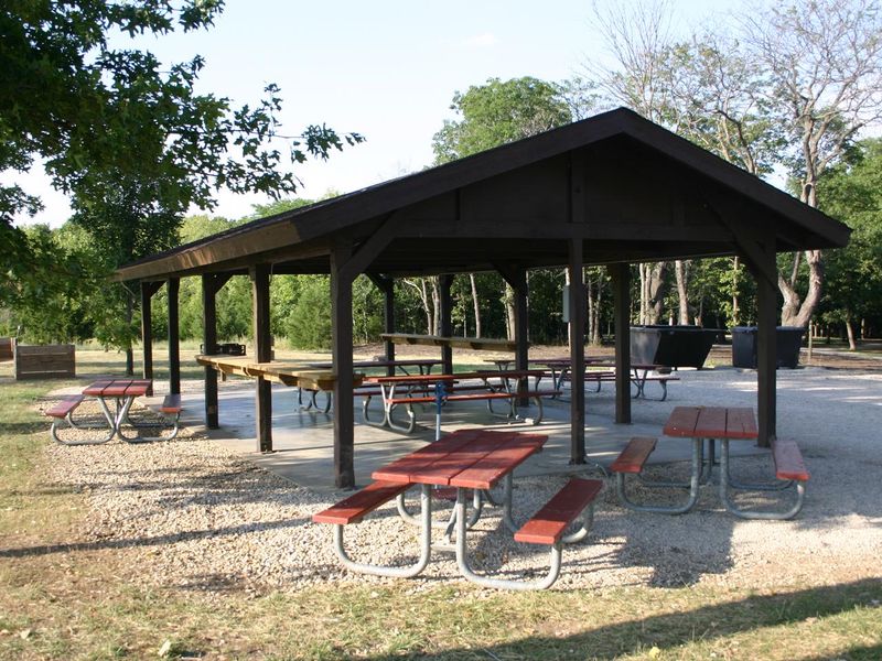 a shelter and numerous picnic tables are located within the Bloomington West campground