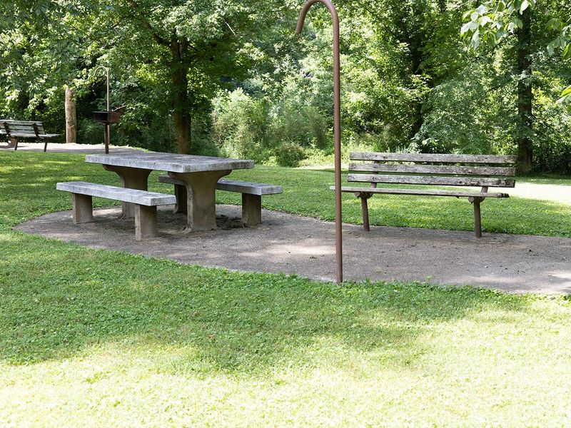 Picnic table and bench for visitor enjoyment and view of the river.