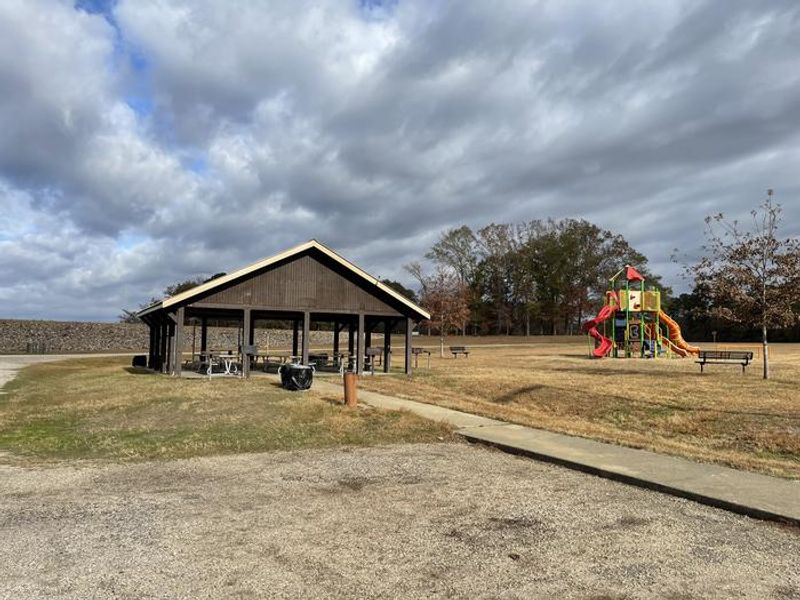 Pavilion with electricity, water, grills, fire ring, and playground. 