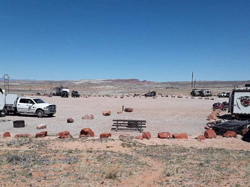 Courthouse Rock Campground campsites with Arches National Park in the distance