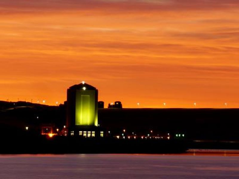Sunrise over the Power Houses and the Missouri River.