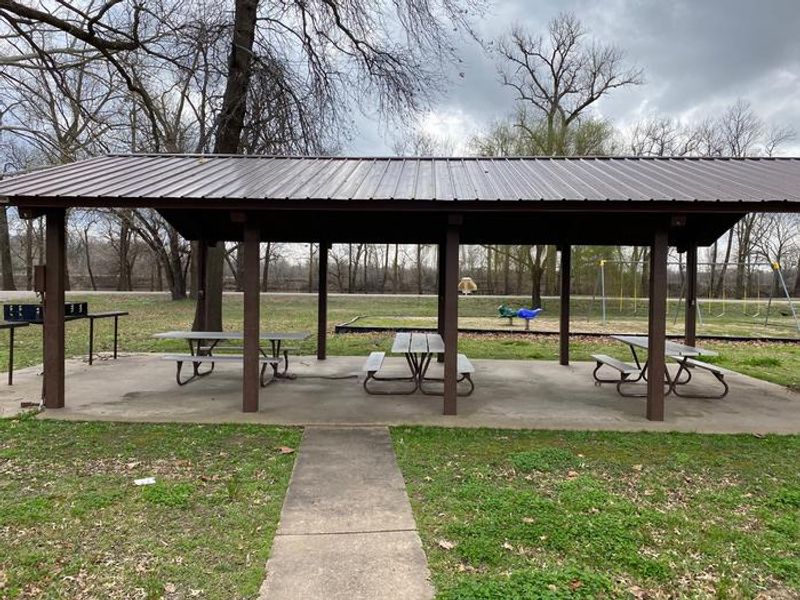 This Shelter/Pavilion area is the perfect spot to get out of the elements and still enjoy a peaceful gathering. This area does have electric and is equipped with several power outlets, picnic tables and grills to be used. 