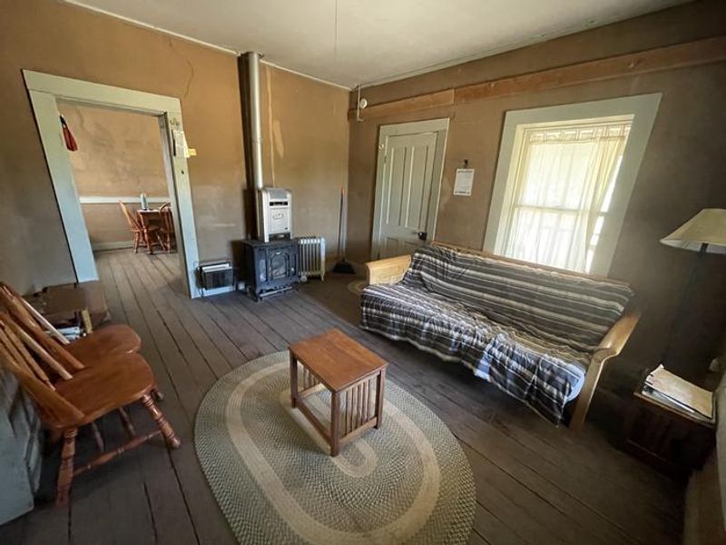 Living room of Kentucky Camp, including futon.