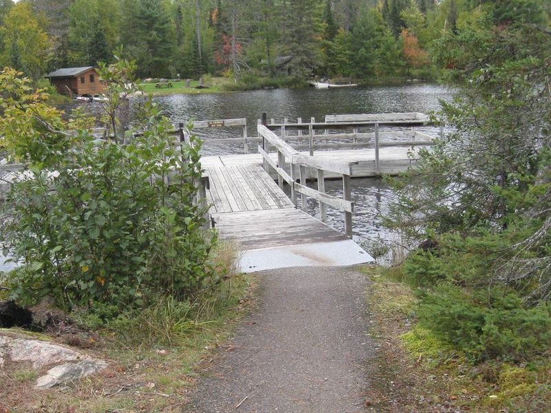 Paved trail accessing fishing pier.