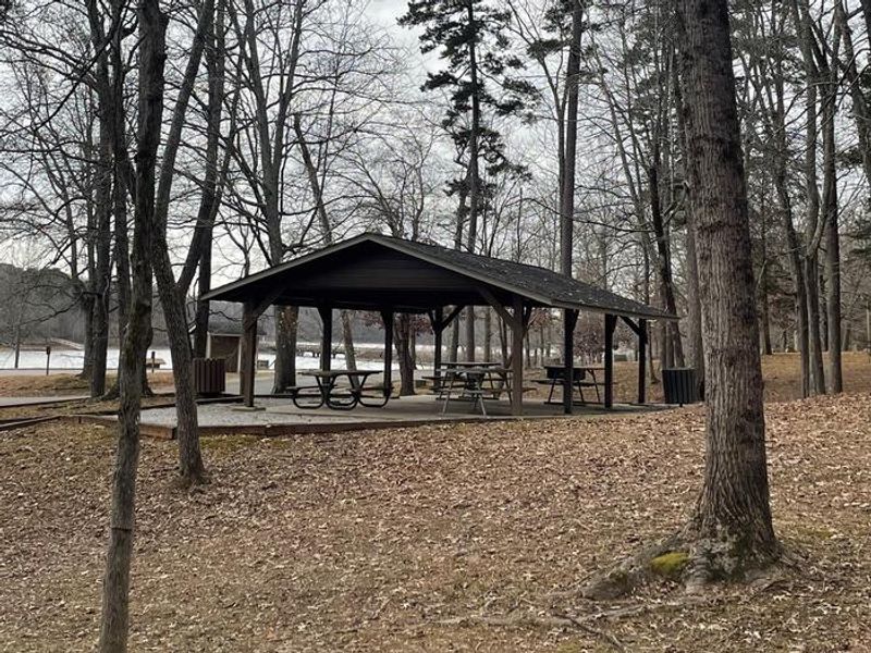 Welcome to Grassy Creek! There is a shelter with a large grill and picnic tables. The shelter does not have electricity.